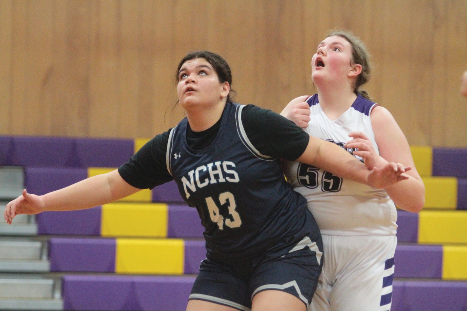 Charlotte Fay of Quilcene looks up for the rebound in action against the Wolverines.